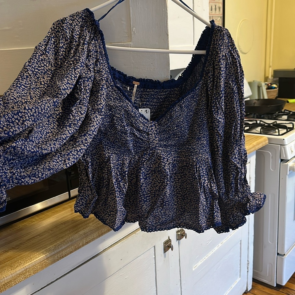 Free people floral women’s top. Brand new with tags never worn.